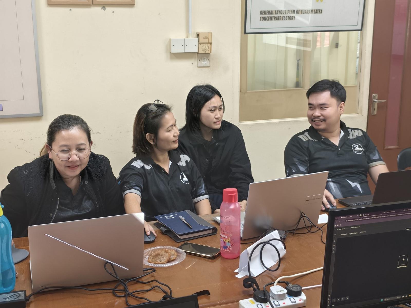 Participants collaborating during a practical AI training session