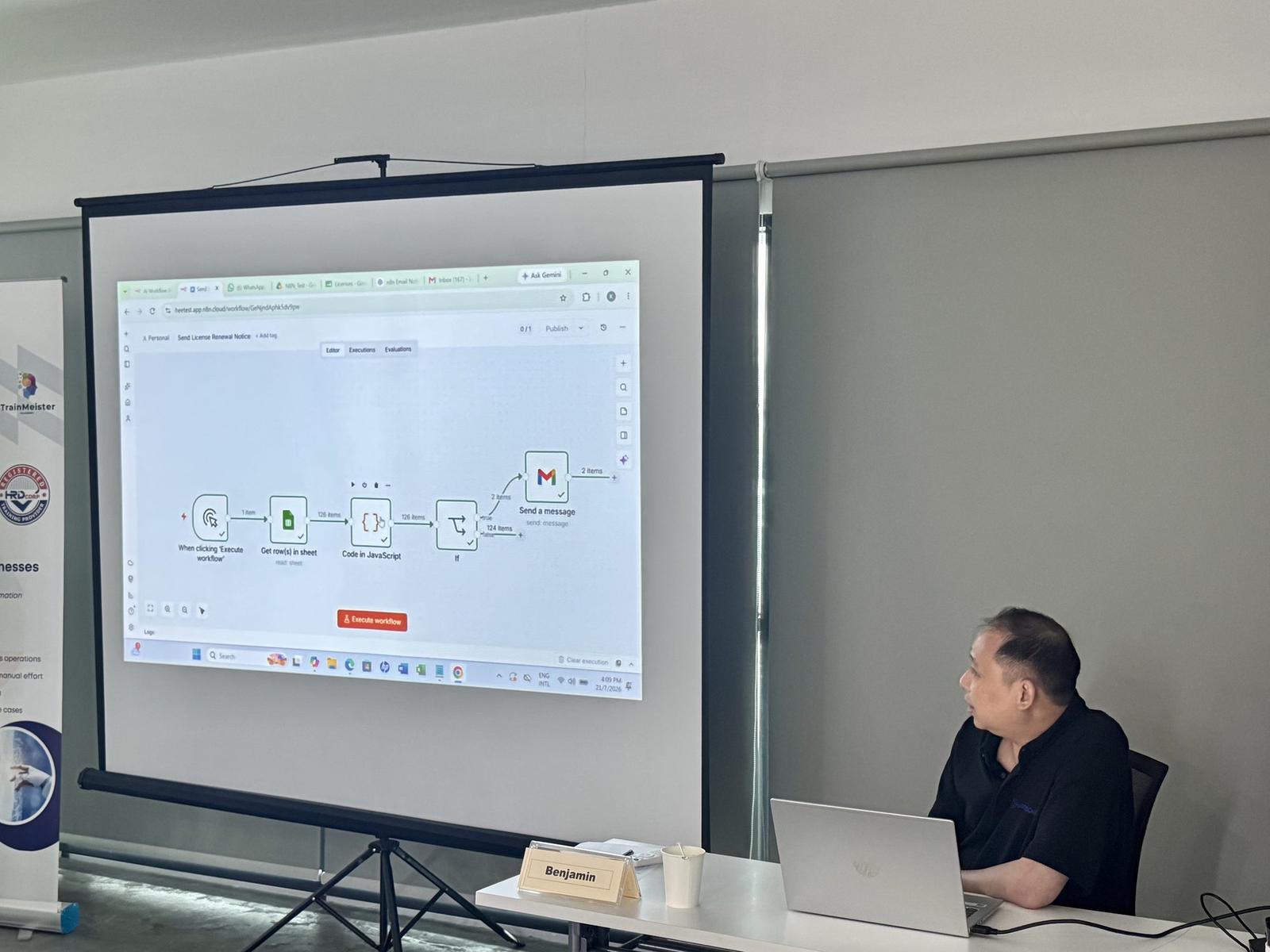 A participant presenting an n8n automation workflow built during training